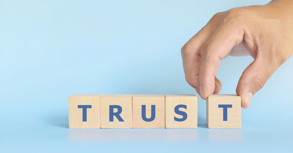 Hand-stacking-wooden-blocks-with-the-word-trust.png