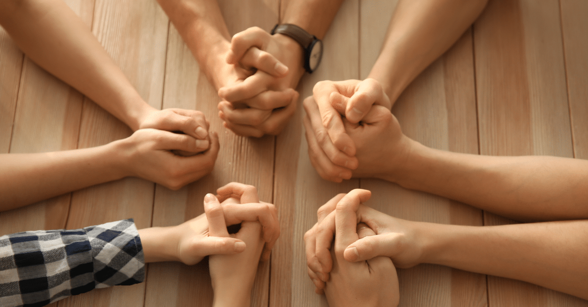Small-Group-of-People-Praying.png