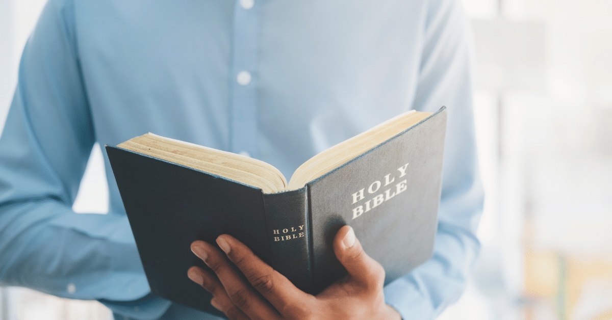 Pastor-With-A-Bible-In-His-Hands.png