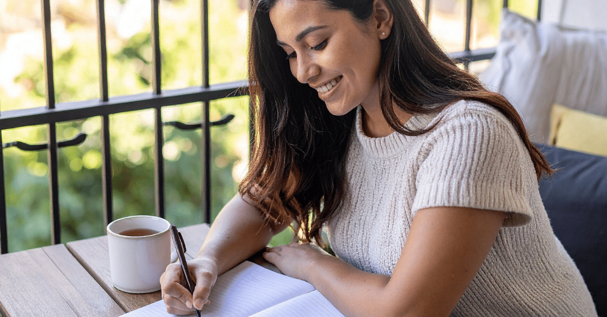 Woman-Writing-in-a-Journal.png