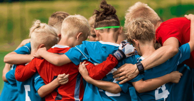Youth-Sports-Coach-with-Kids-on-Soccer-Field.png