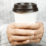 Woman-Holding-Coffee-Cup.png