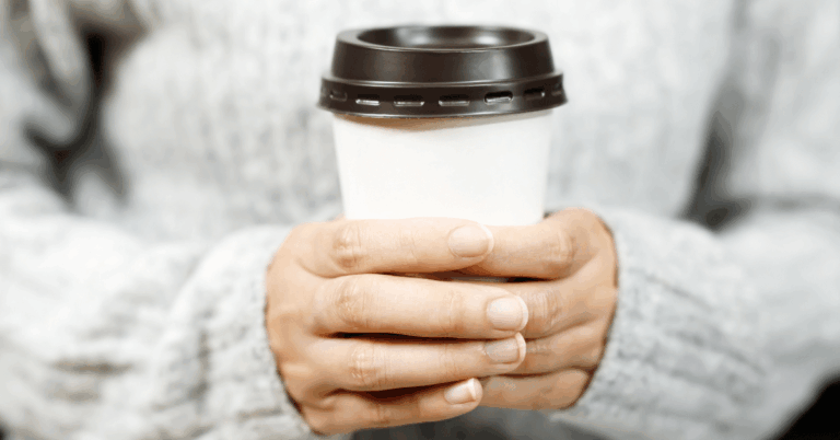 Woman-Holding-Coffee-Cup.png